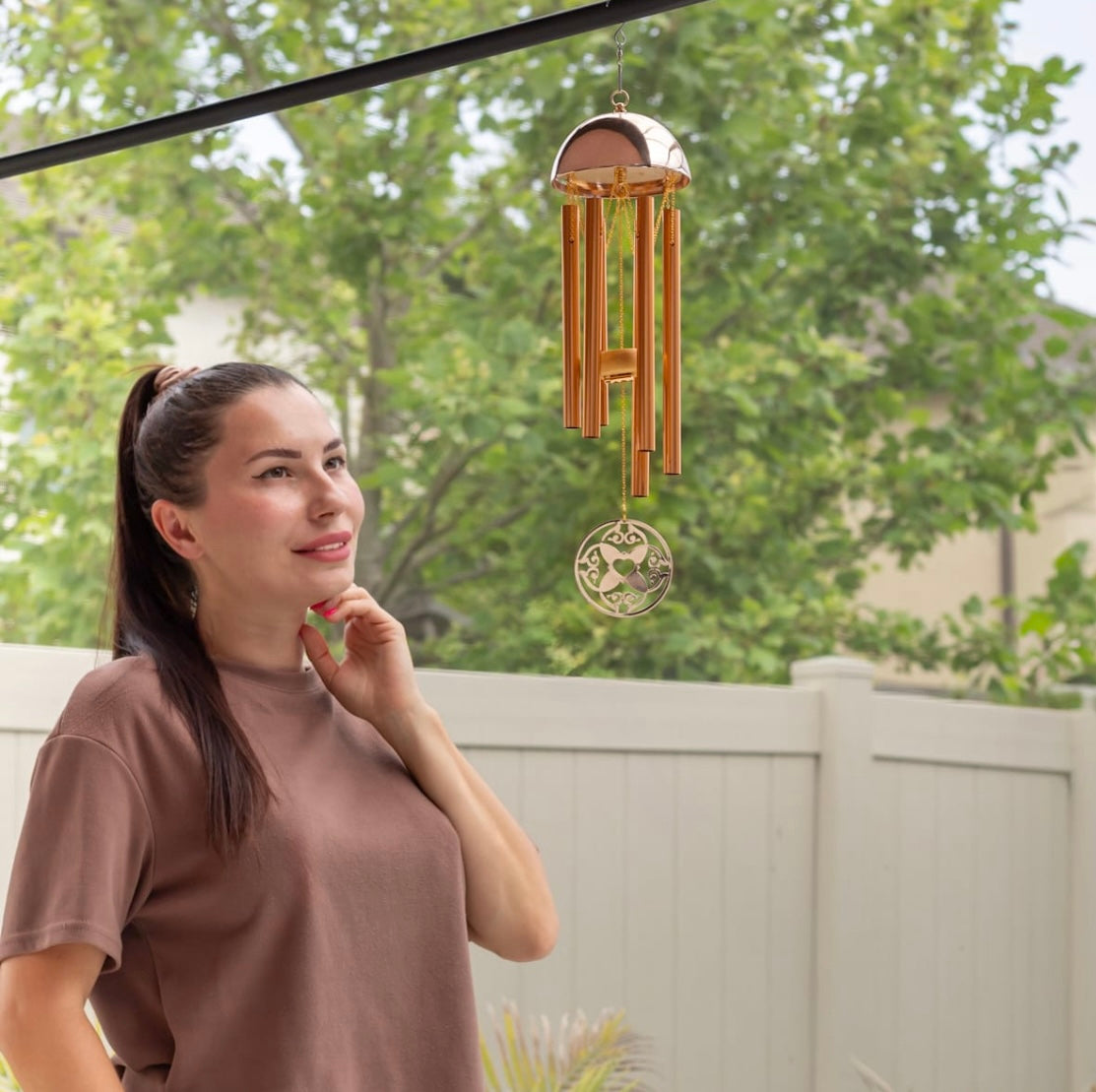 Memorial wind chime from Whispering Hearts™ collection by The Wind Chime Co, 15-inch warm gold with heart-shaped design.