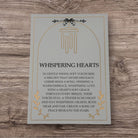 Rose gold memorial wind chimes from The Wind Chime Co's Whispering Hearts collection, featuring a memorial heart, 28-inch length.