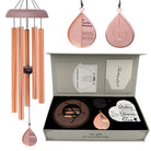 Memorial wind chimes from The Wind Chime Co's Whispering Hearts collection with rose gold finish and a memorial heart, 28 inches long.