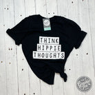 Unisex Think Hippie Thoughts graphic T-shirt by The Graphic Tee, featuring a colorful hippie-inspired design on a casual SS tee.