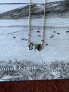 Turquoise butterfly concho chain necklace by Wild Junkie featuring a silver-tone chain with butterfly and concho accents.