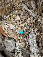 Gold chain necklace with a turquoise heart pendant, stylish jewelry piece by Wild Junkie.