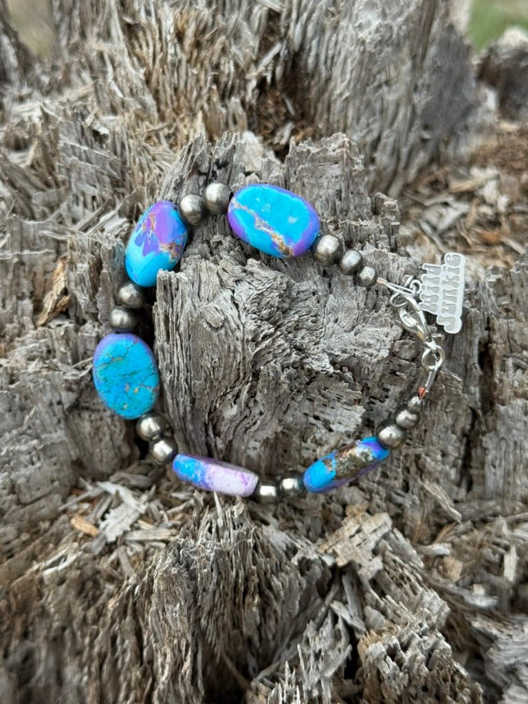 Turquoise Twilight Oval Beaded Bracelet by Wild Junkie featuring oval-shaped turquoise beads and intricate beaded detailing.