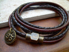 Dark brown leather bracelet with Om charm and antique brass magnetic clasp, triple wrap design, from Urban Survival Gear USA.