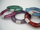 Women's rhinestone and leather wrap bracelet with stainless steel magnetic clasp, featuring metallic pearl accents and a 6-inch fit.