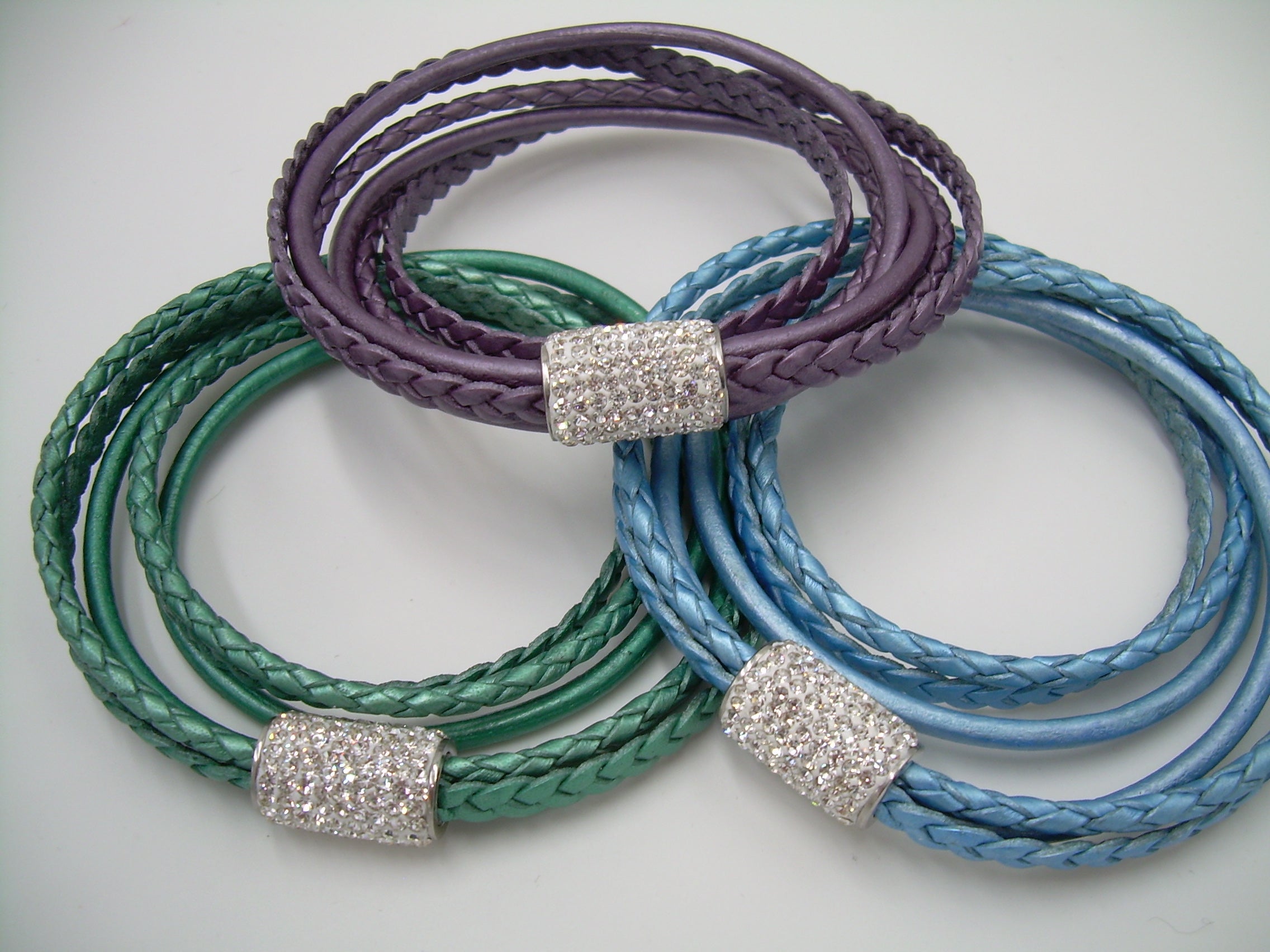 Women's rhinestone and leather wrap bracelet with stainless steel magnetic clasp, featuring metallic pearl accents and fits a 6-inch wrist.