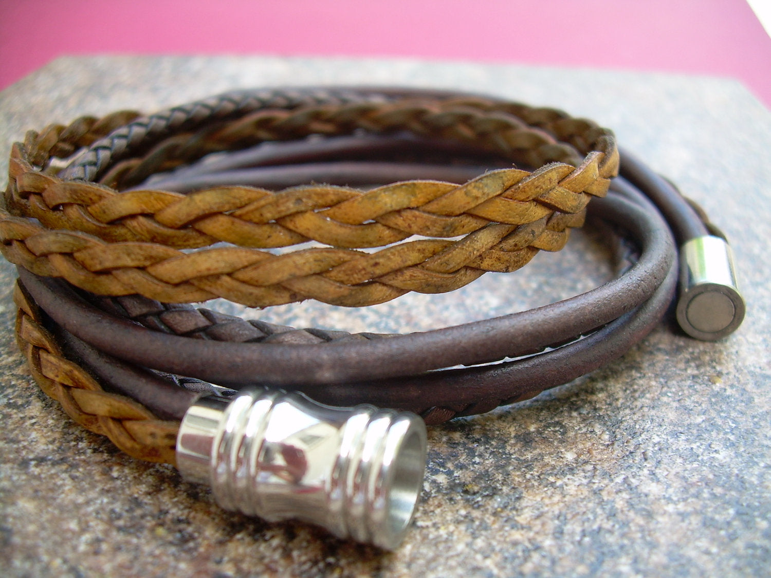Leather men's and women's wrap bracelet with stainless steel magnetic clasp, featuring urban-style design and adjustable fit.