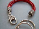 Red leather wristlet bracelet and valet keychain by Urban Survival Gear USA, fits a 6-inch wrist, stylish and functional accessory.
