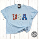 USA 90's inspired floral graphic SS tee by The Graphic Tee, mid-length pigment-dyed design with vibrant floral print.