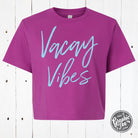 Women's Vacay Vibes boxy graphic tee by The Graphic Tee, featuring a relaxed fit and vibrant vacation-inspired design.