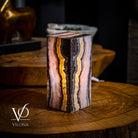 Vilona Onyx Razzberry Rosa Onyx desk lamp with a sleek, modern design and vibrant pink and purple hues on a wooden surface.