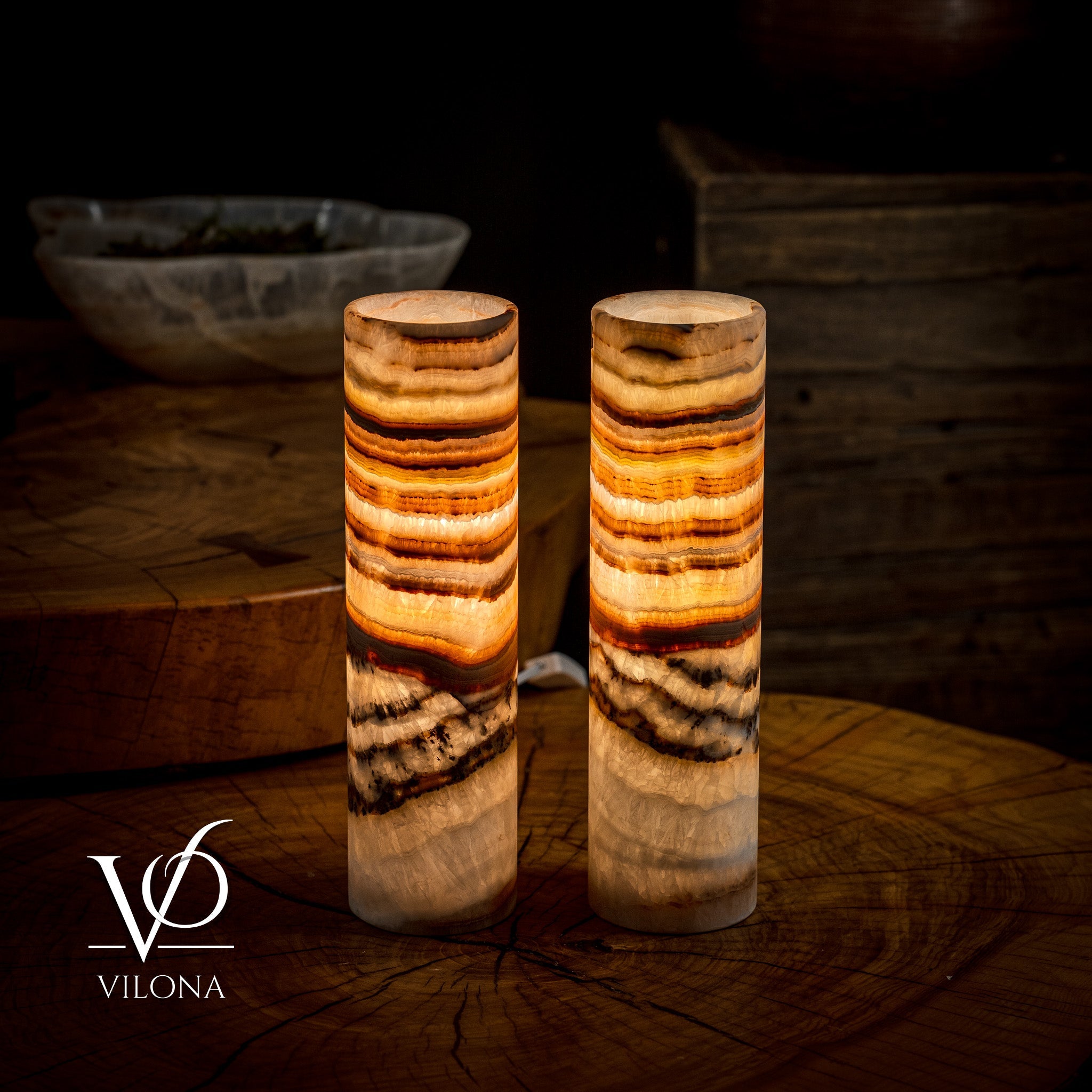 Pair of Vilona Onyx Sahara Onyx desk lamps with cylindrical black bases and warm-toned shades for elegant table lighting.