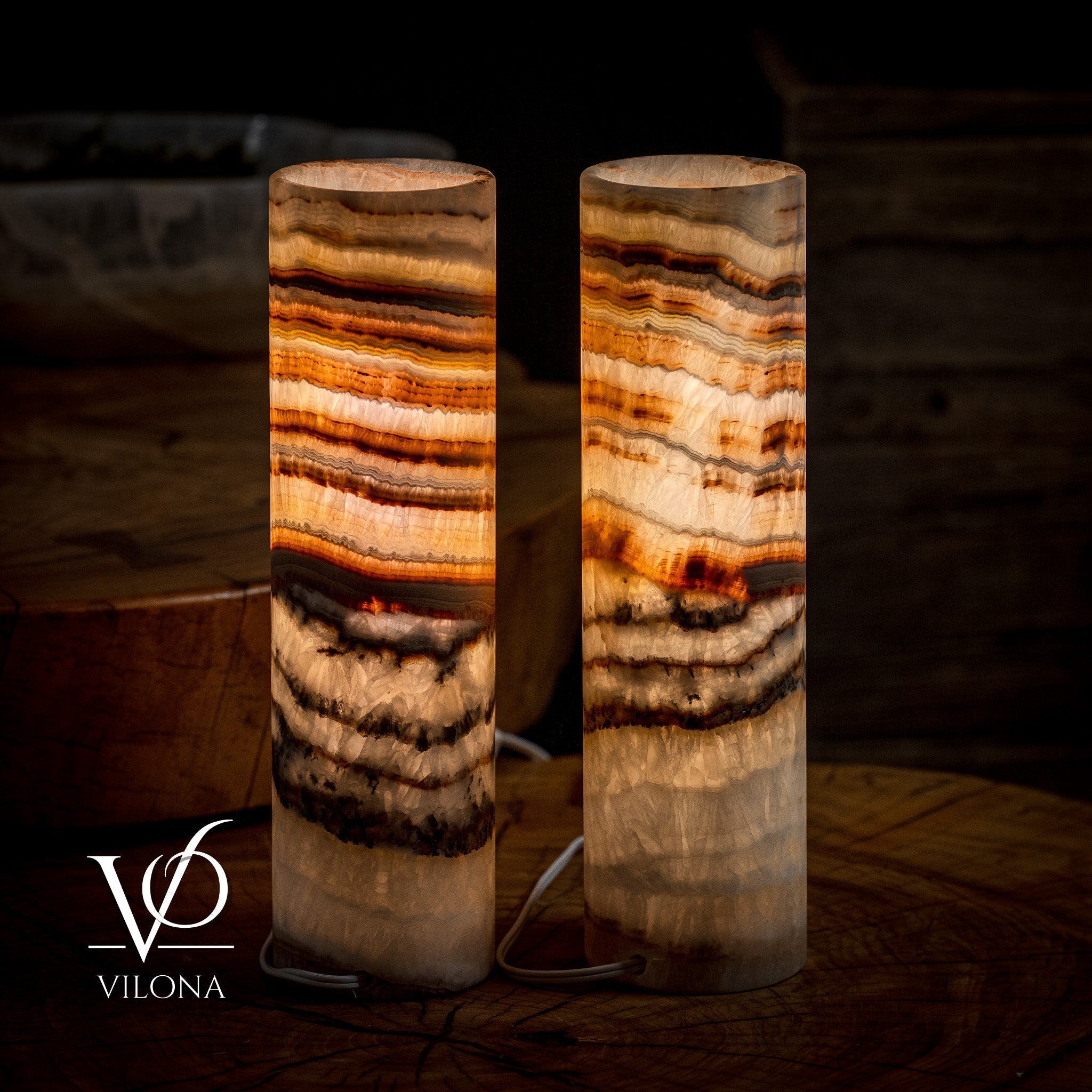 Pair of Vilona Onyx Sahara Onyx desk lamps featuring cylindrical table lamp design with polished black stone bases.
