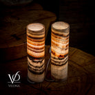 Pair of Vilona Onyx Sahara Onyx desk lamps with cylindrical shape, featuring black and gold finish for elegant table lighting.