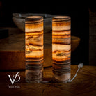 Pair of Vilona Onyx Sahara Onyx cylinder desk lamps, stylish table lamps with sleek black and natural stone finish.