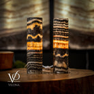 Pair of Vilona Onyx Tangerine Crystal desk lamps, featuring vibrant orange onyx bases and clear crystal accents.