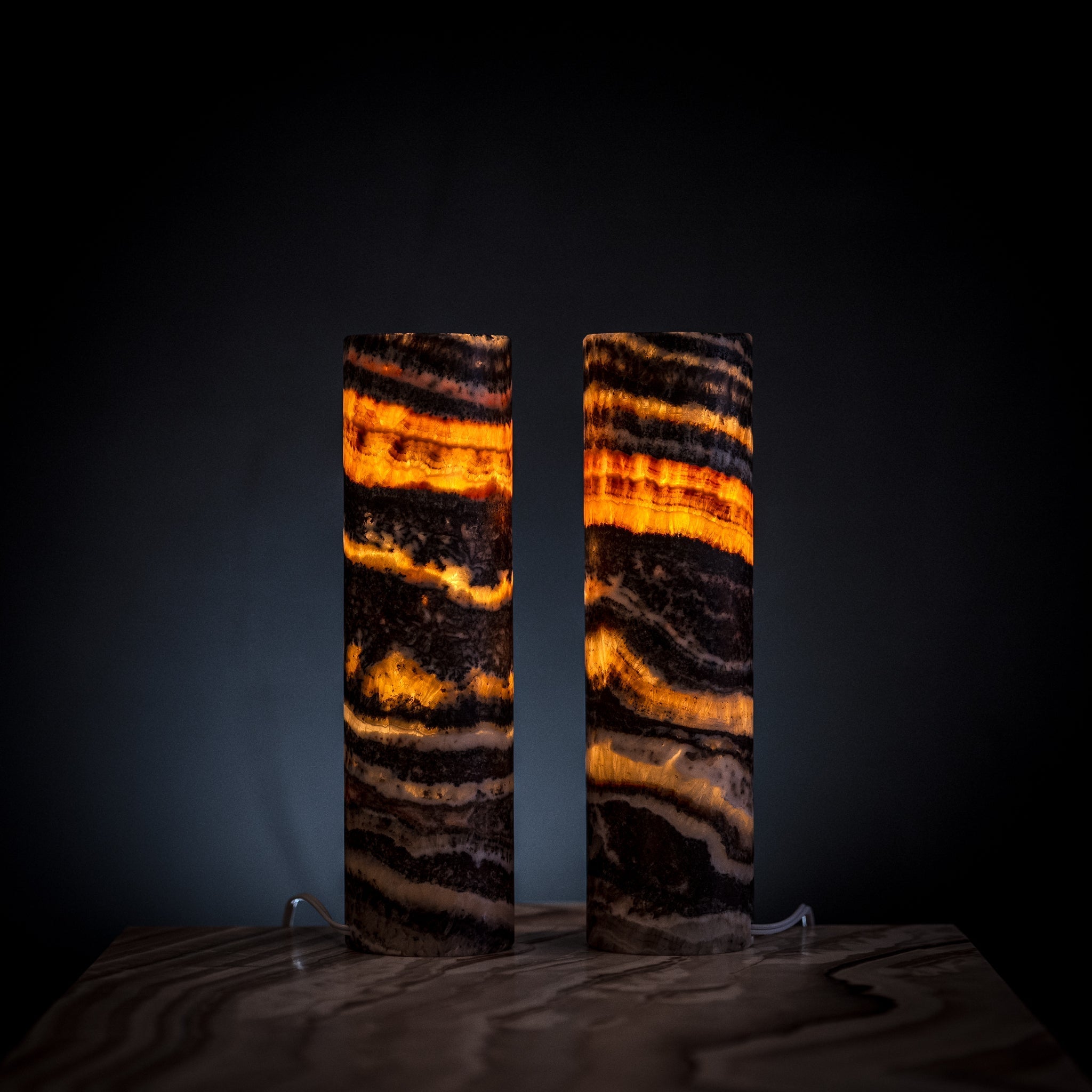 Pair of Vilona Onyx Tangerine Crystal desk lamps, featuring vibrant orange onyx bases and elegant lighting design.