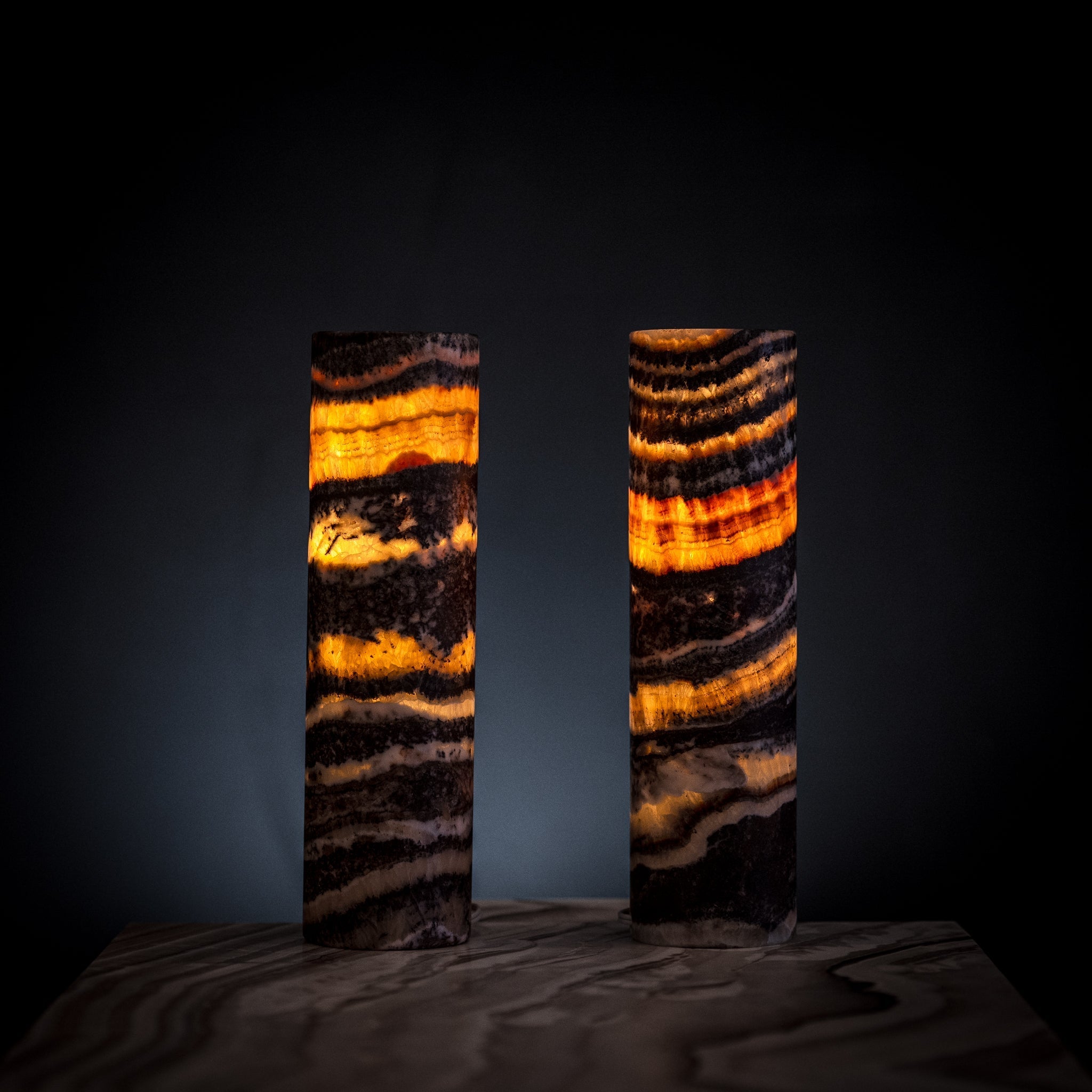 Pair of Vilona Onyx Tangerine Crystal desk lamps with vibrant orange onyx bases and elegant crystal accents.