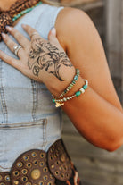 Gold desert turquoise beaded bracelet from Wild Junkie featuring vibrant turquoise stones and gold-toned beads.