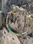 Gold desert turquoise beaded bracelet by Wild Junkie featuring vibrant turquoise beads and gold accents on a delicate bracelet.