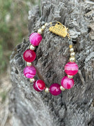 Gold Wild Rose Agate beaded bracelet by Wild Junkie featuring round polished agate beads and gold accents.