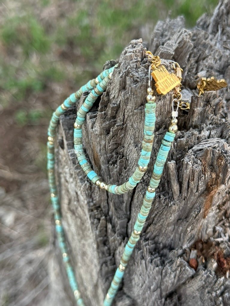 Golden turquoise trail heishi beaded bracelet from Wild Junkie featuring small round beads on a stretch cord.