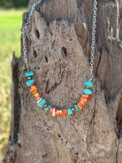 Authentic Spiny Oyster Chip Bead Necklace featuring vibrant orange and red natural stone beads, stylishly strung for a boho look.