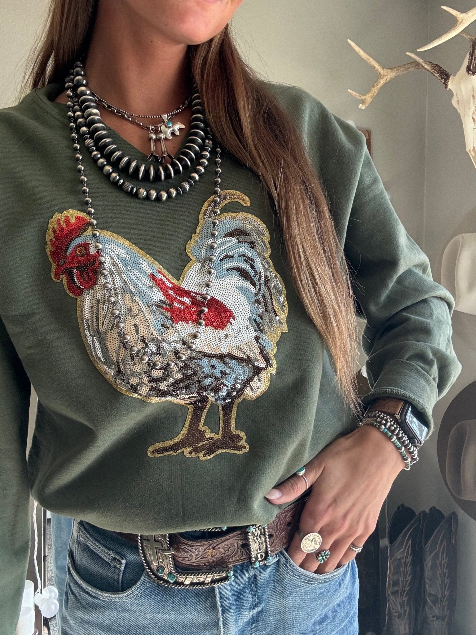 Wild Junkie rooster sequin V-neck graphic sweatshirt with colorful rooster design and comfortable fit.