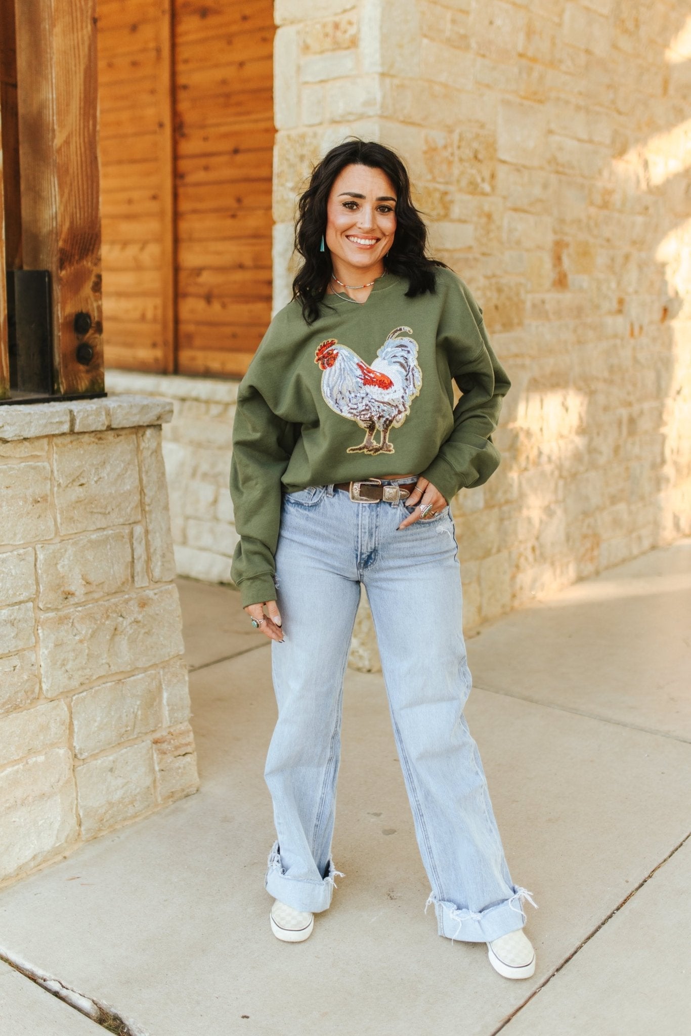 Wild Junkie rooster sequin V-neck graphic sweatshirt featuring a colorful rooster design on soft fabric.