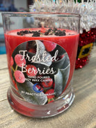 Frosted Berries Candle from Practical Magic Store featuring a cozy, frosted berry design in a glass jar.