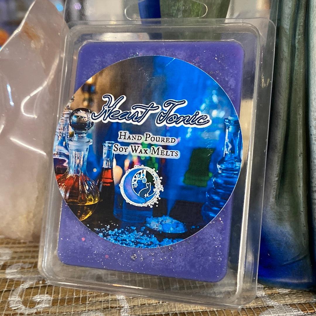 Heart Tonic soy wax melt from Practical Magic Store, showing a heart-shaped wax melt with a smooth, creamy surface and soft pink color.