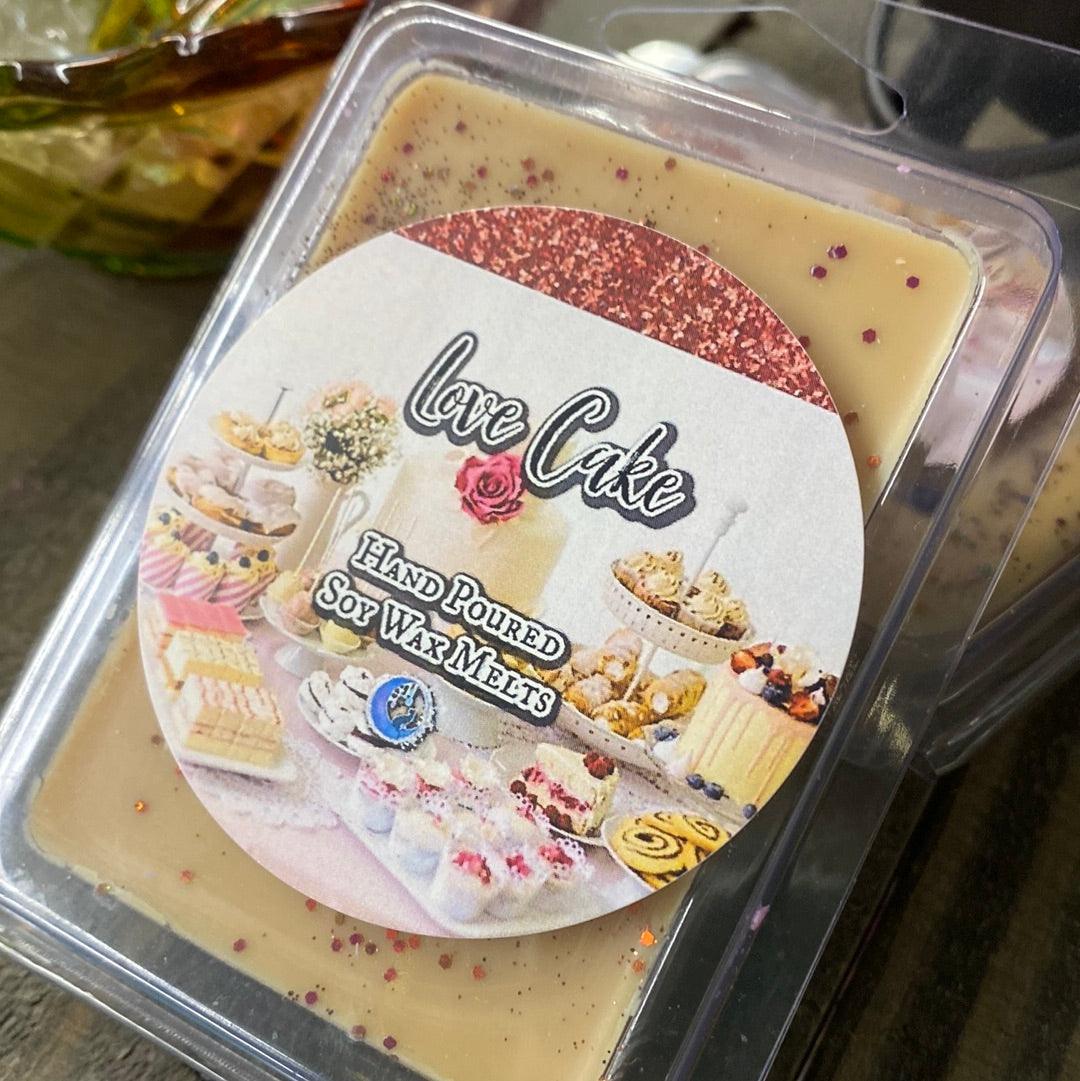 Love Cake soy wax melts by Practical Magic Store, featuring heart-shaped wax pieces with a sweet, bakery-inspired scent.
