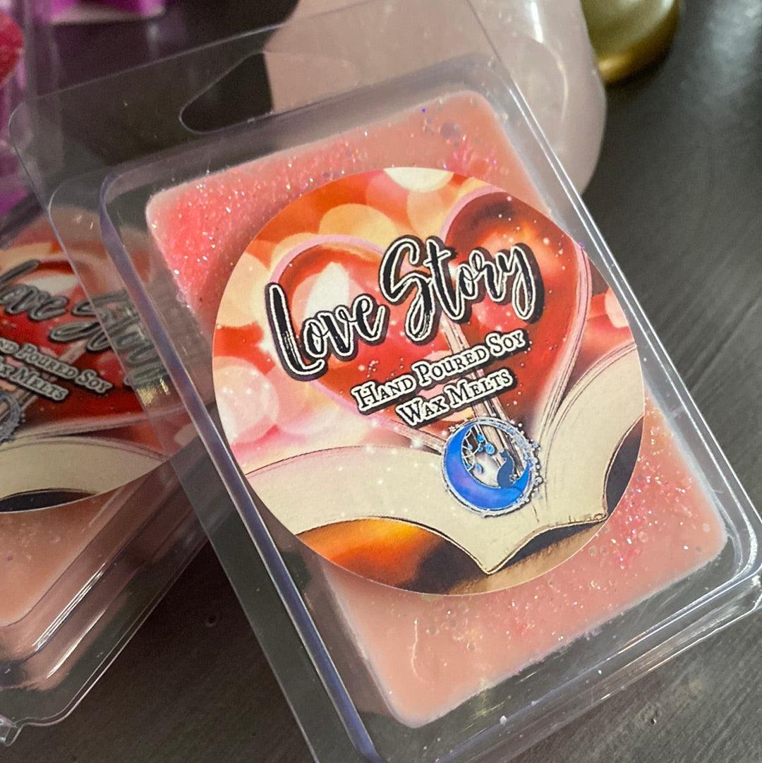 Love Story soy wax melt from Practical Magic Store, showing a decorative melt with floral design and soft pastel colors.